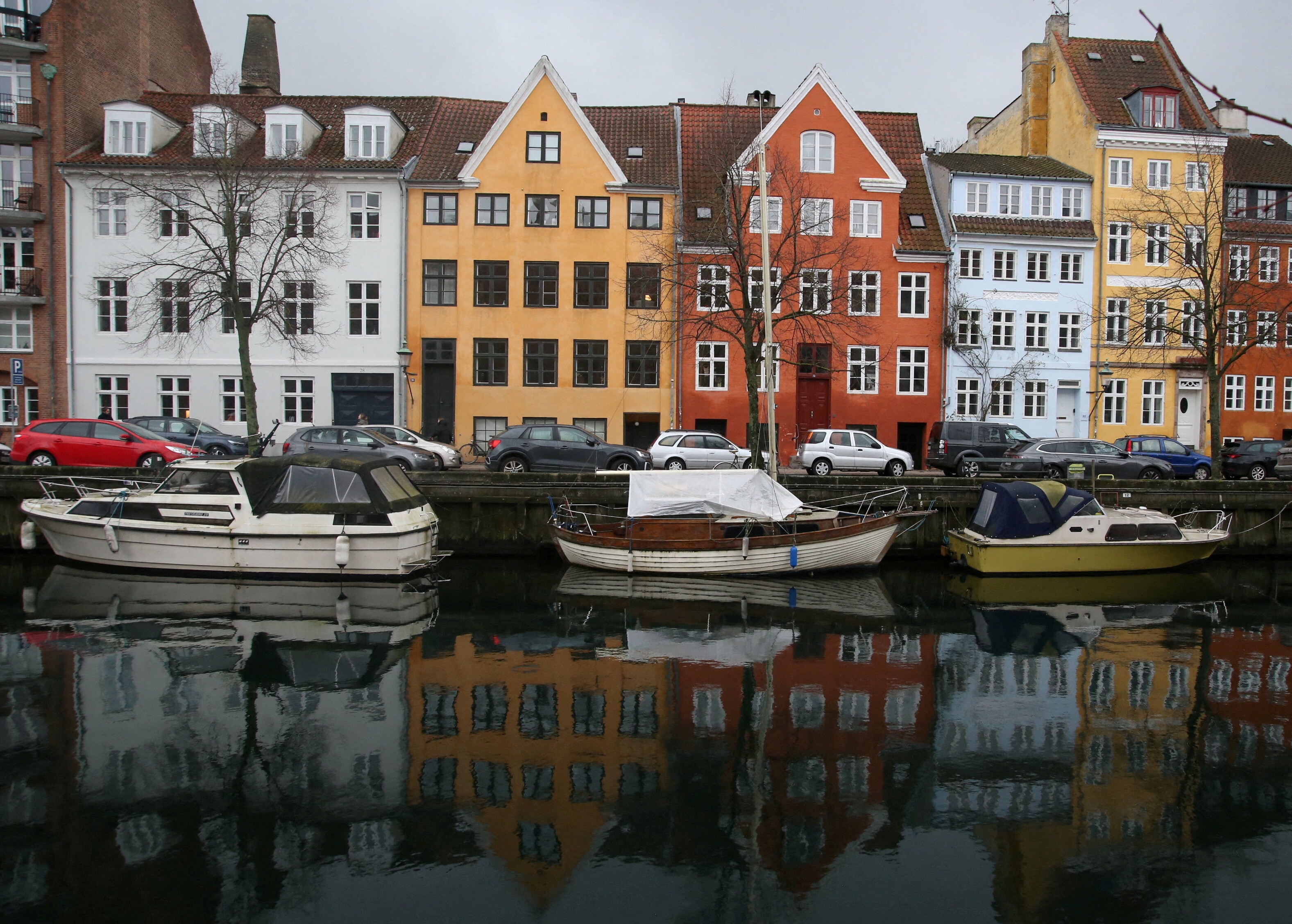 Buildings are reflected in the water along the Christianshavn Canal in Copenhagen, Denmark, January 26, 2025