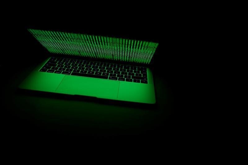 A computer lit by a displayed cyber code is seen in this illustration picture taken on March 1, 2017.