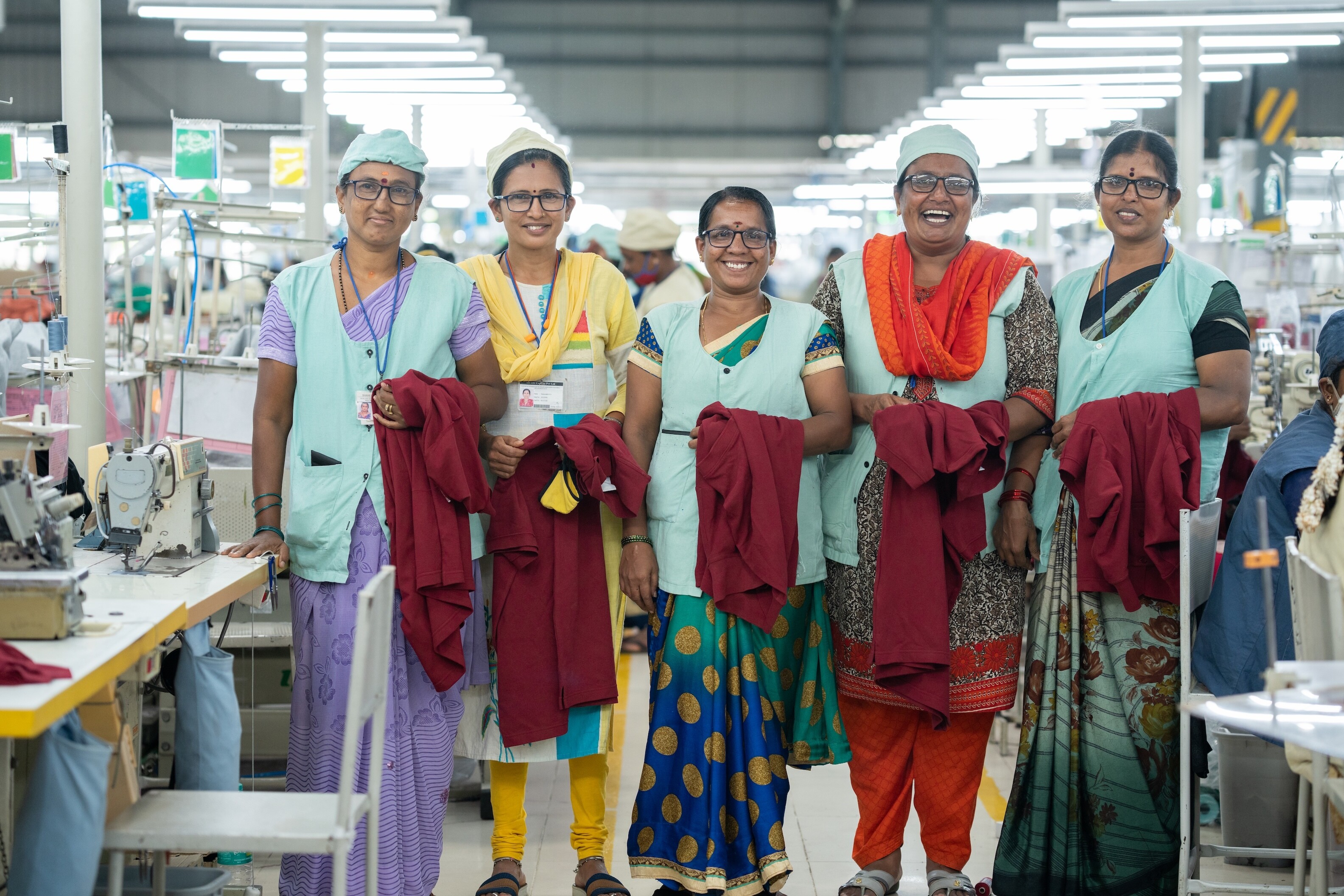 Workers at a Shahi Exports garment factory in India wear their new eyeglasses for the first time. 