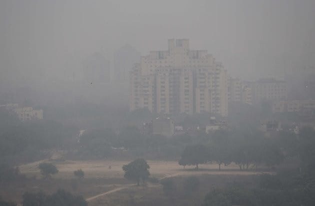 GURGAON, INDIA - DECEMBER 4: Heavy smog engulfed the city that made commuting difficult as visibility was less than 50 meters, on December 4, 2017 in Gurgaon, India. Air quality remained very poor with air quality index at 320, which agencies consider unfit for inhalation even by healthy people. The minimum temperature was recorded at 10 degree Celsius and maximum was recorded at 23 degree Celsius. Smog thickened in the evening as number of vehicles increased on the roads when people rushed home. (Photo by Sanjeev Verma/Hindustan Times via Getty Images)