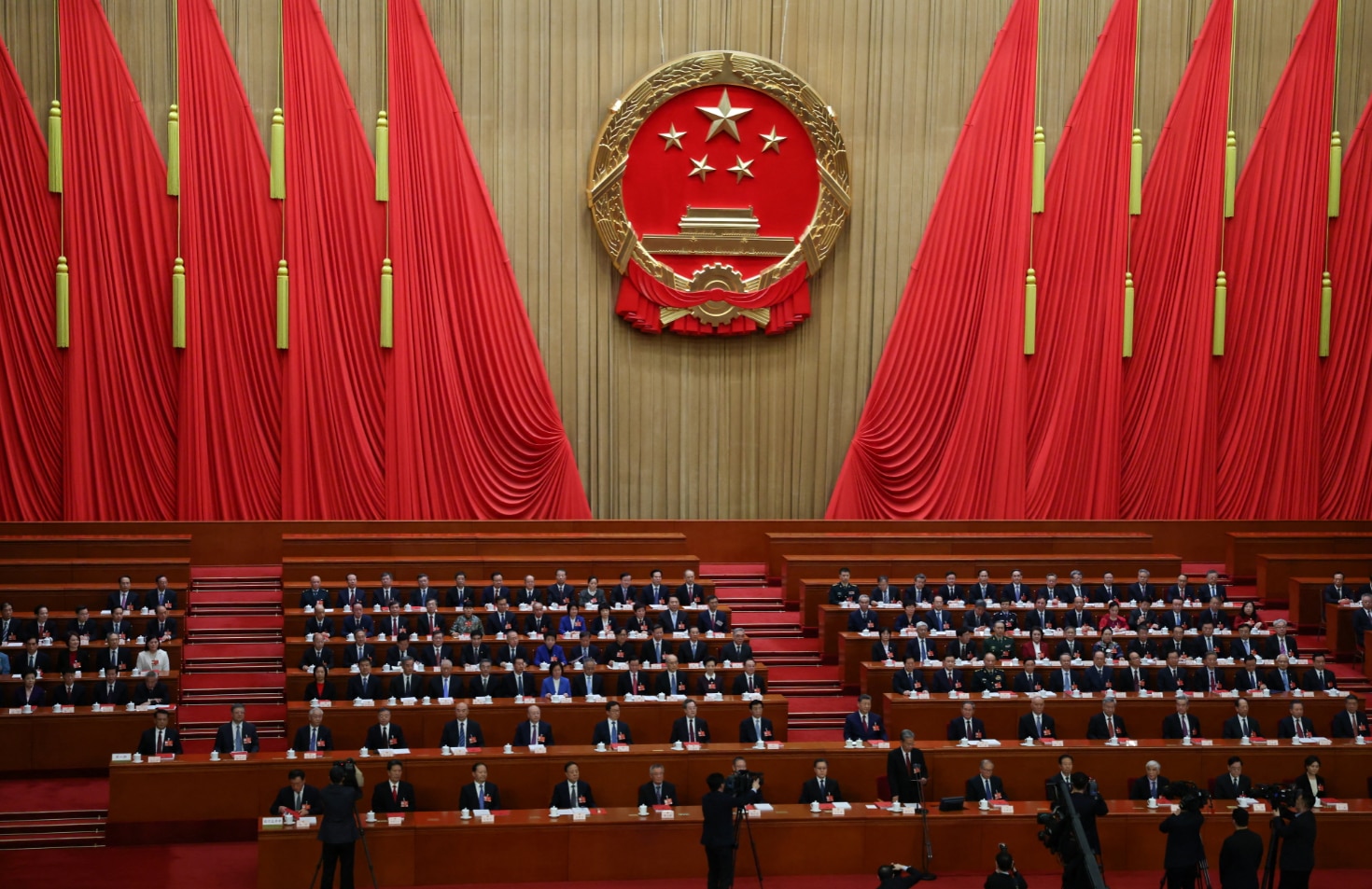 Chinese President Xi Jinping, Chinese Premier Li Qiang and other government officials attend the closing session of the National People's Congress (NPC) at the Great Hall of the People in Beijing, China, March 12, 2026. REUTERS/Tingshu Wang