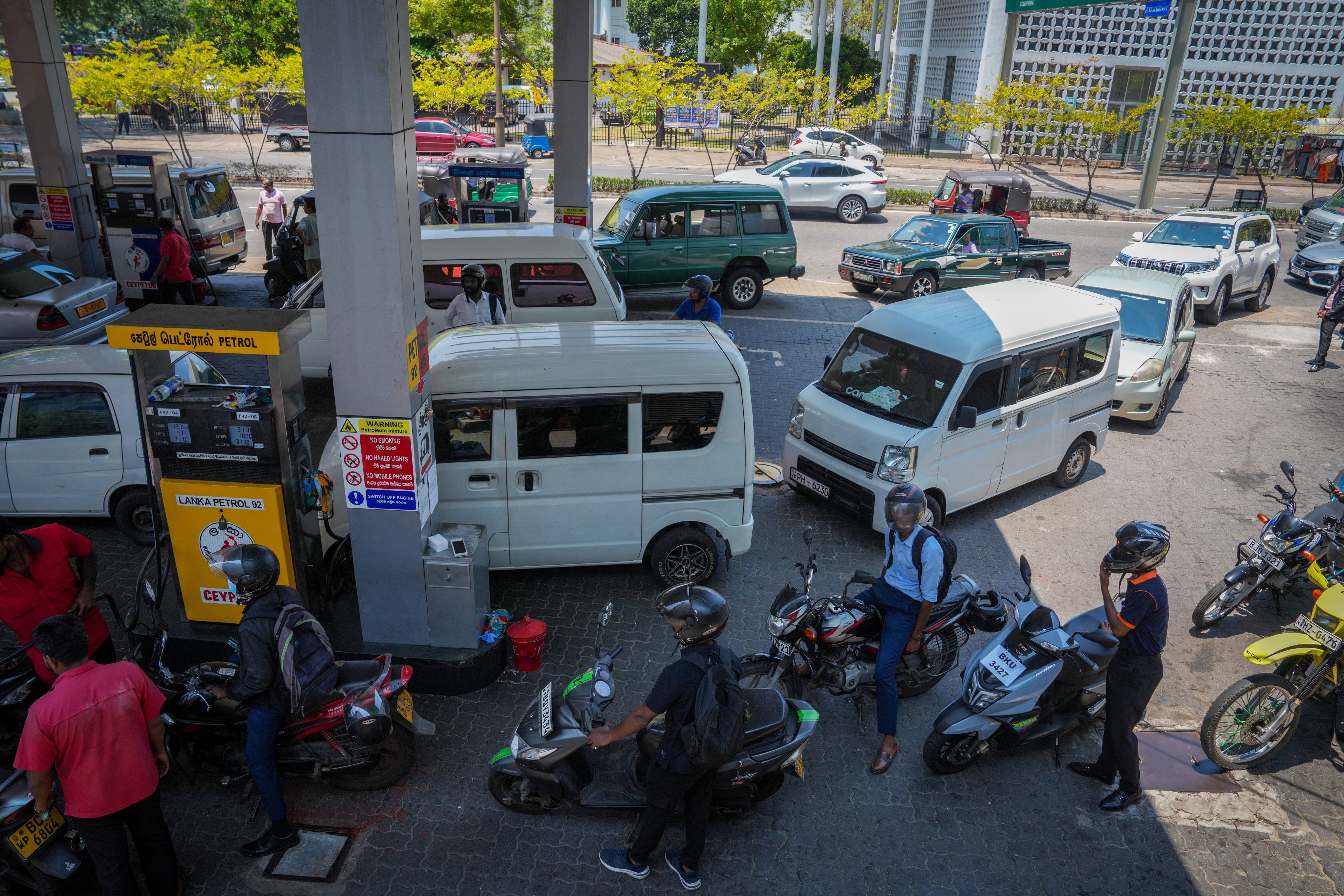 Vehicles queue to buy petrol at a fuel station, due to concerns over fuel supply amid the U.S.-Israel conflict with Iran, in Colombo, Sri Lanka.