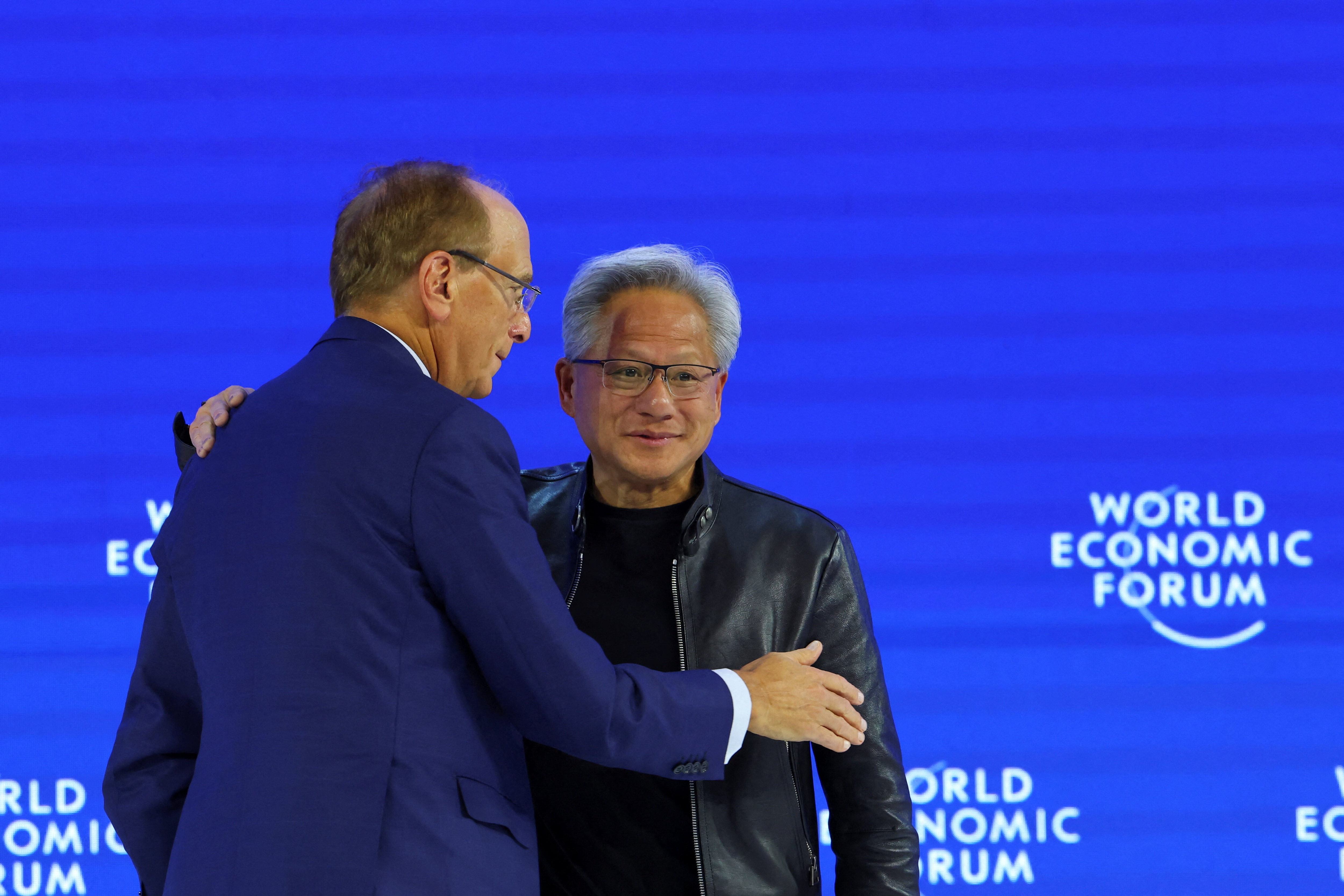 President and CEO of NVIDIA, Jensen Huang and Chairman and CEO of BlackRock, Larry Fink attend the 56th annual World Economic Forum (WEF) meeting in Davos, Switzerland, January 21, 2026