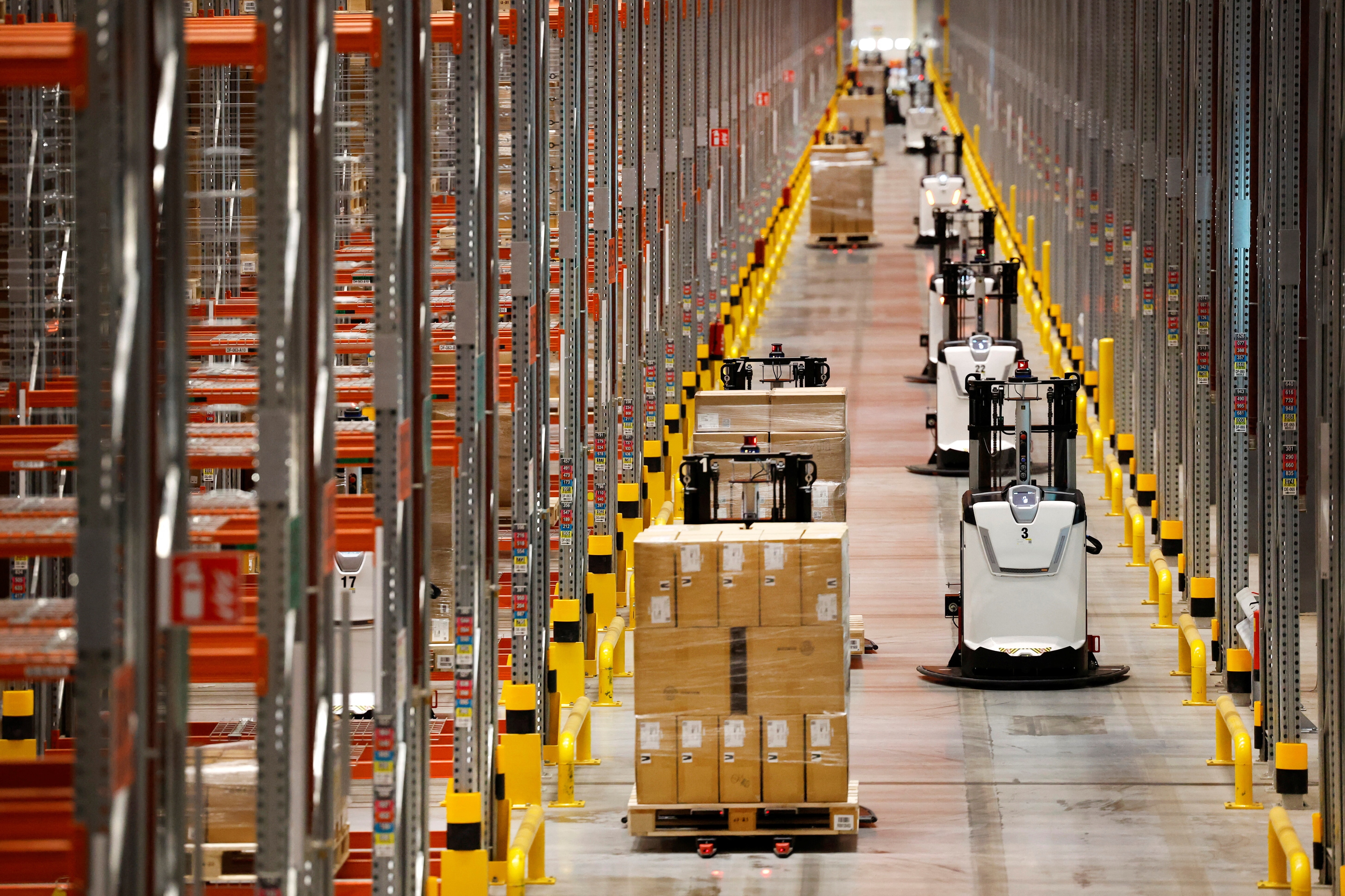 Autonomous guided vehicles are seen at Primark's warehouse in Roosendaal, Netherlands November 16, 2022. REUTERS/Piroschka van de Wouw