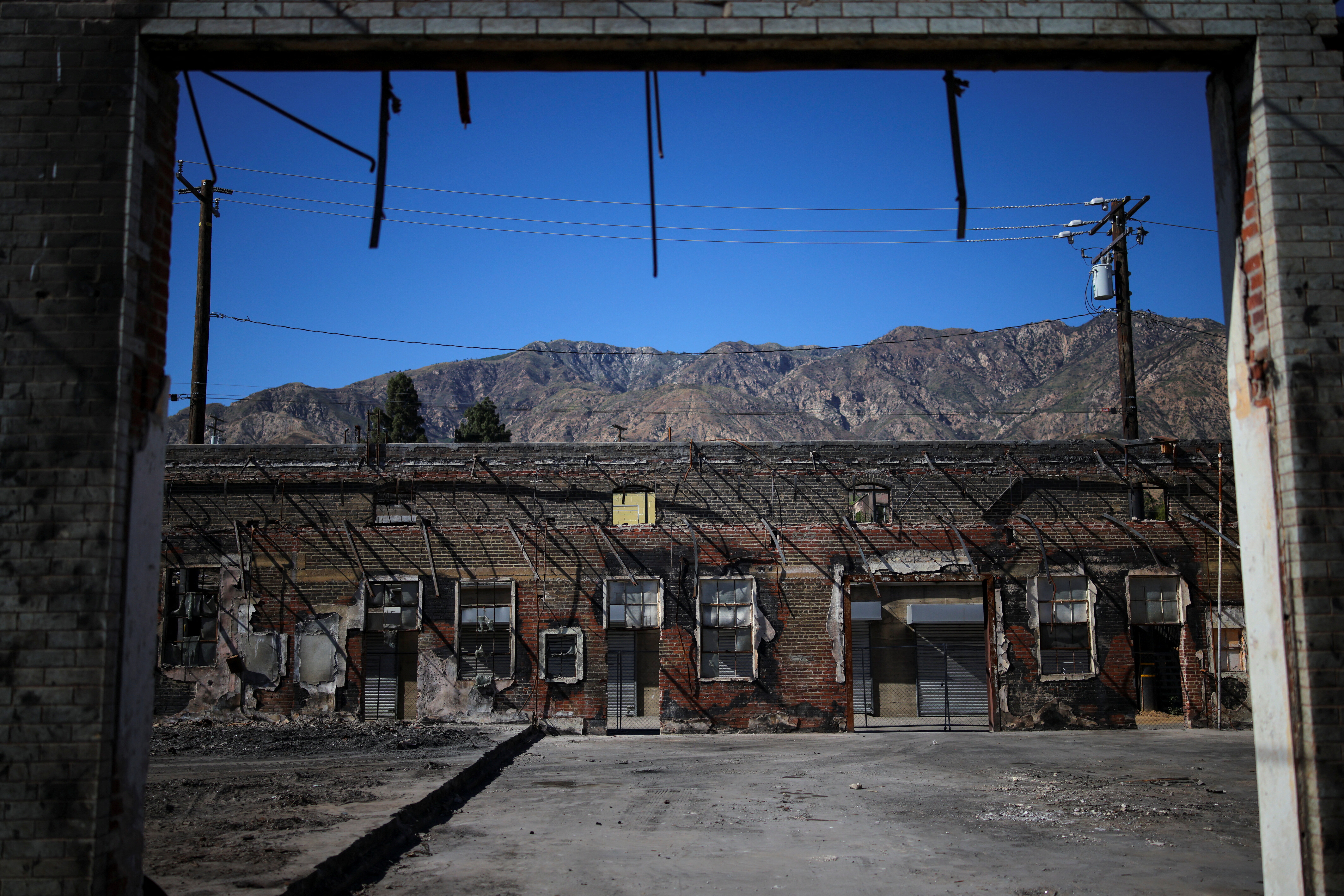 A commercial strip cleared of fire debris is seen in Altadena, California, U.S., June 29, 2025. The fires broke out on January 7, when dry desert winds whipped over mountain passes with hurricane force, following eight months without rain. The fires killed 22 people, destroyed nearly 12,000 homes and caused as much as $53.8 billion in property damage.
