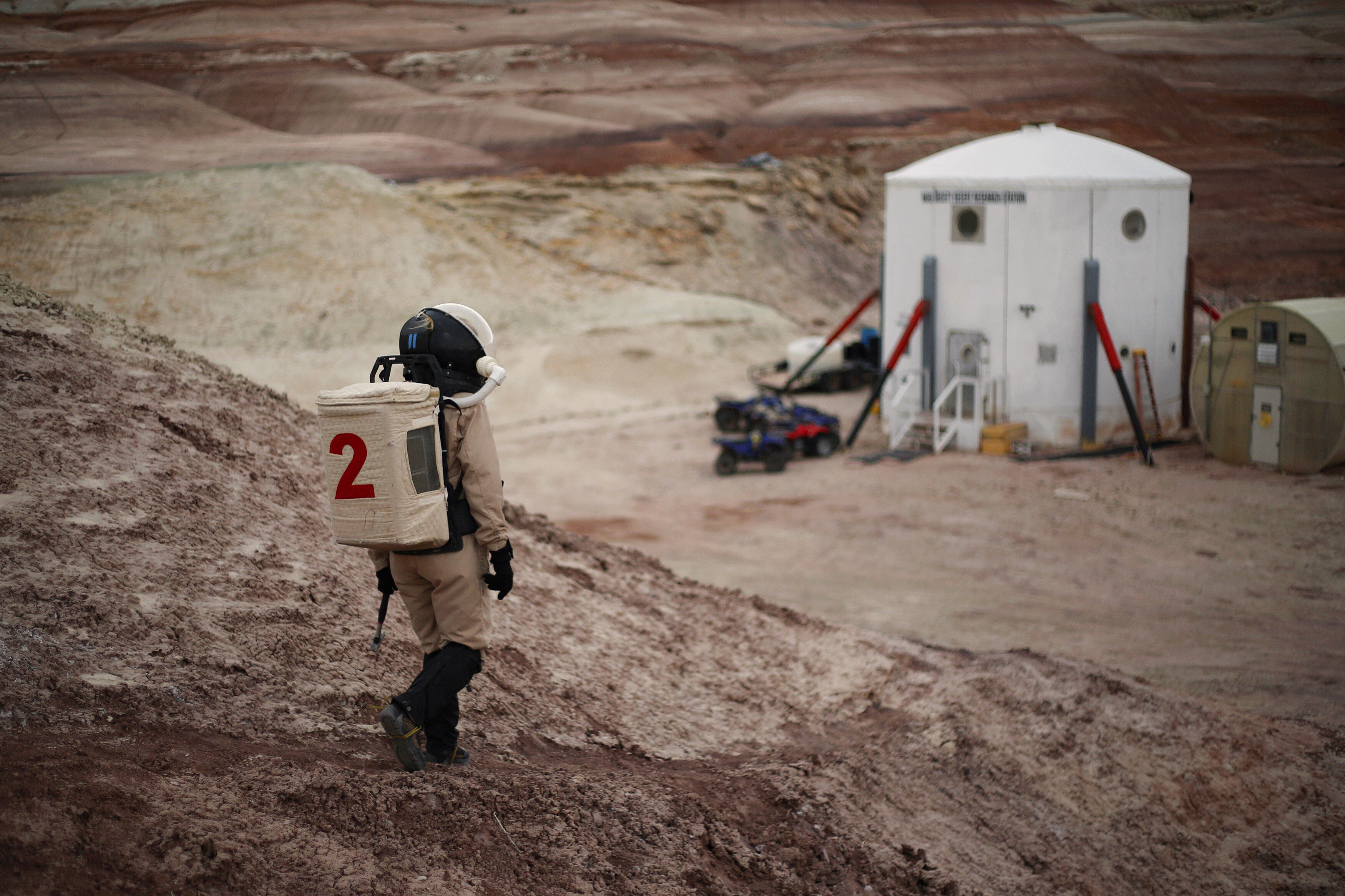 Csilla Orgel, a geologist of Crew 125 EuroMoonMars B mission, makes her way back to the Mars Desert Research Station (MDRS) in the Utah desert March 3, 2013. 
