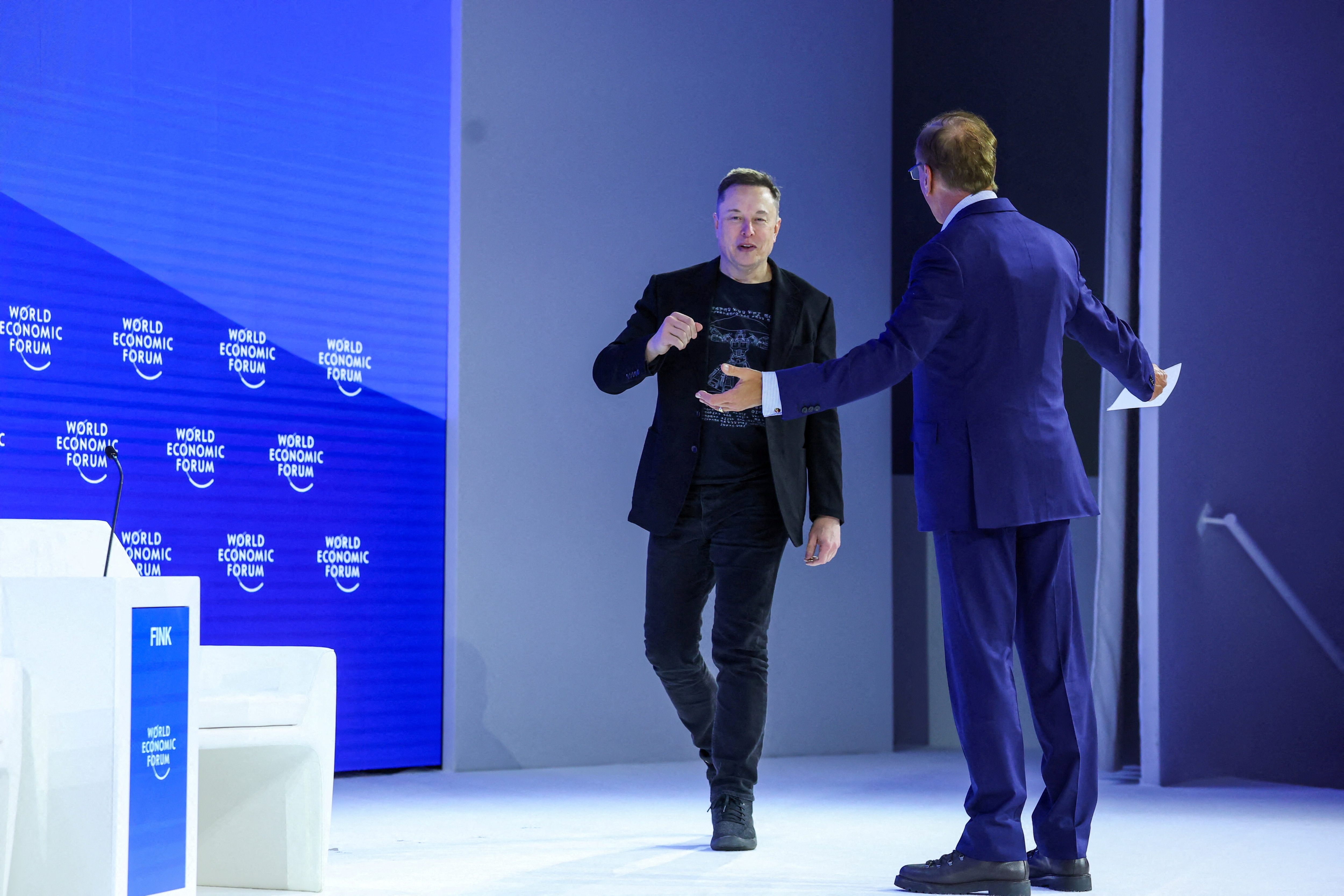 Elon Musk and CEO of BlackRock, Larry Fink, attend the 56th annual World Economic Forum (WEF) meeting in Davos, Switzerland, January 22, 2026