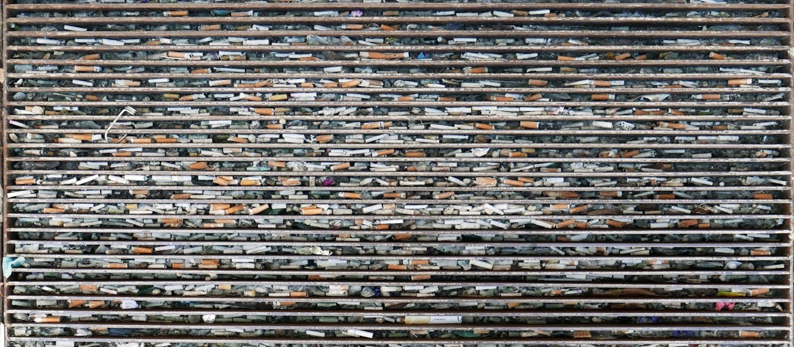 Plastic cigarette filters don’t work, harm the environment and should