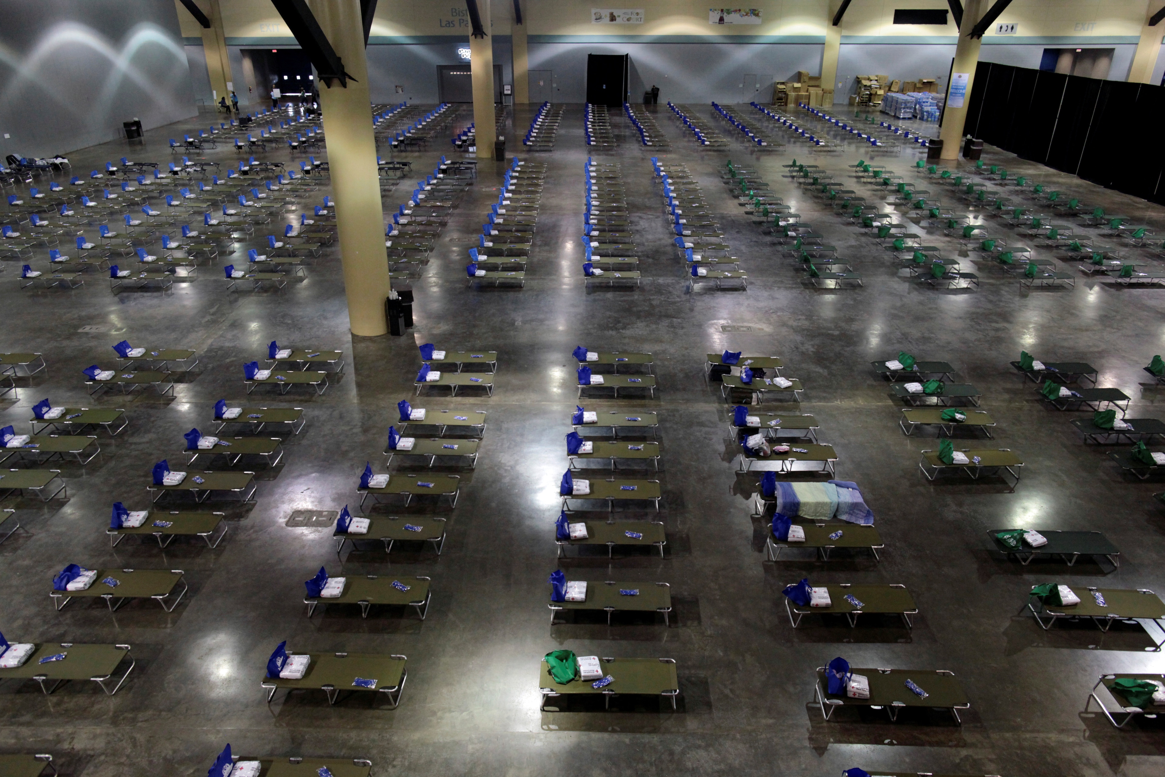 Camp beds are set up at a convention centre for Caribbean refugees whose homes were destroyed by Hurricane Irma, in San Juan, Puerto Rico September 14, 2017.  REUTERS/Alvin Baez - RC14373F5390          