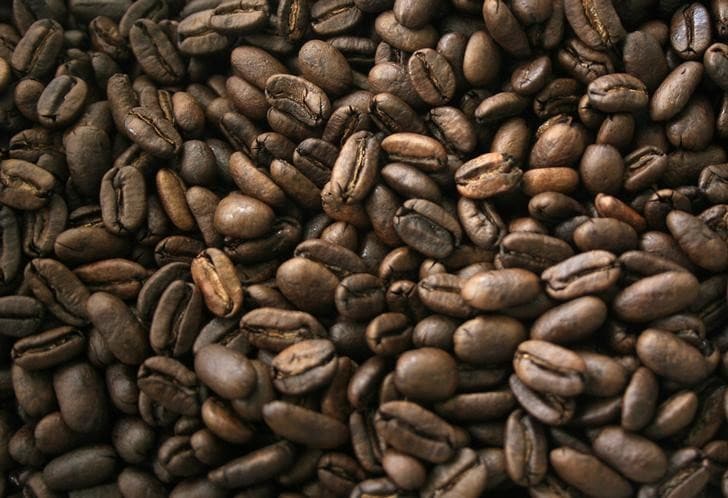 Coffee beans are seen as they are being packed for export in Medan, Indonesia's North Sumatra province April 25, 2013. A lower coffee export volume from Vietnam, the world's largest robusta producer, plus delayed shipment in rival robusta producer Indonesia, could push up prices due to tighter supply in the coming weeks. Indonesia and Vietnam account for nearly a quarter of the world's coffee output.     