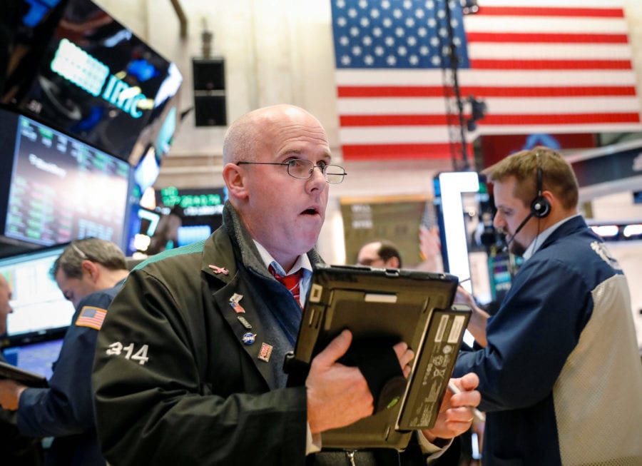 Traders work on the floor of the New York Stock Exchange, (NYSE) in New York, U.S., April 10, 2018. REUTERS/Brendan McDermid