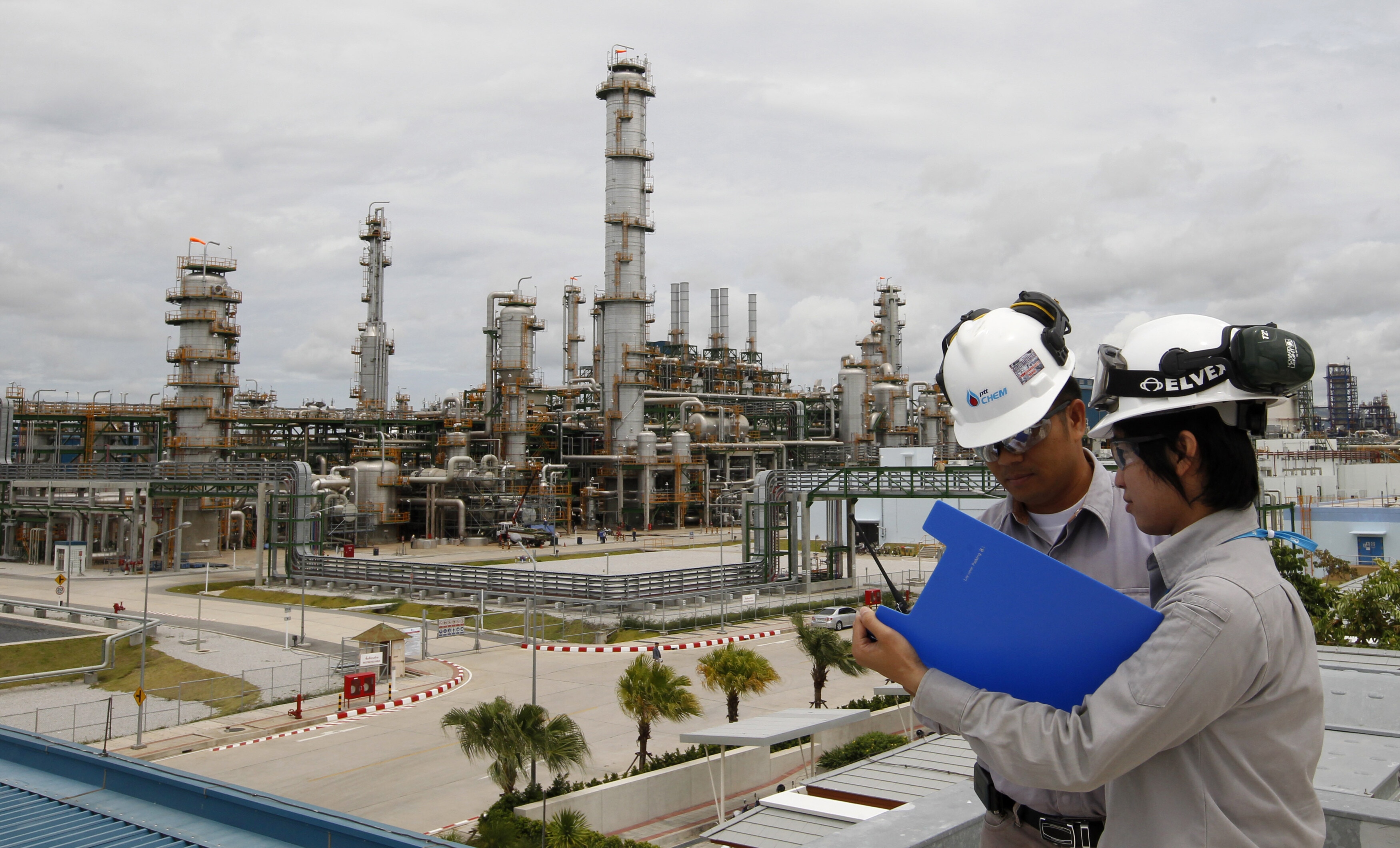 Technicians work at a Thailand's PTT Chemical Pcl complex in the eastern province of Rayong.