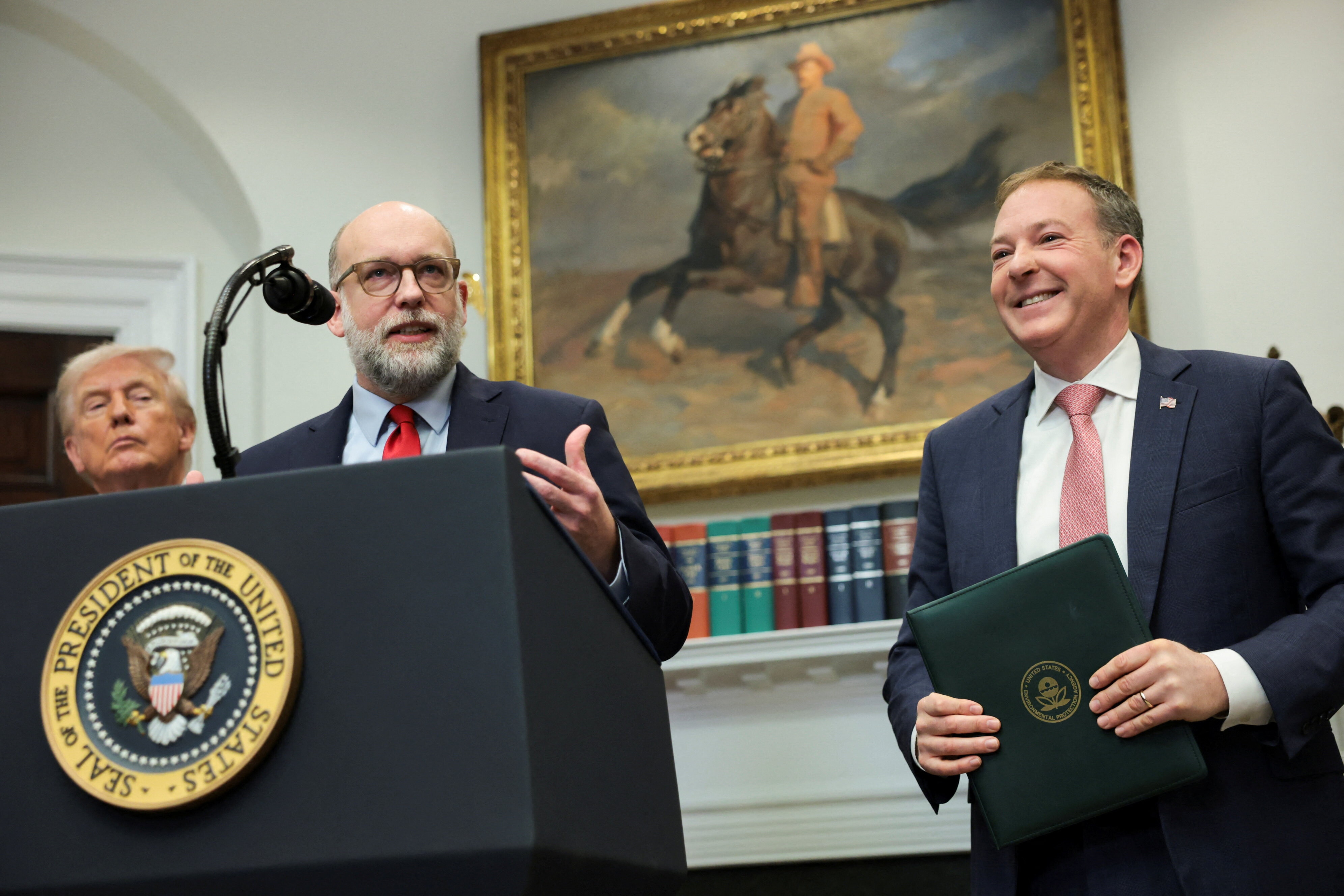 Director of the Office of Management and Budget (OMB) Russell Vought speaks, joined by U.S. President Donald Trump and Environmental Protection Agency (EPA) Administrator Lee Zeldin, at the White House in Washington, D.C., U.S., February 12, 2026