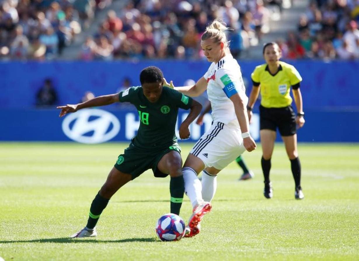 Soccer Football - Women's World Cup - Round of 16 - Germany v Nigeria - Stade des Alpes, Grenoble, France - June 22, 2019 Nigeria's Halimatu Ayinde in action with Germany's Alexandra Popp 