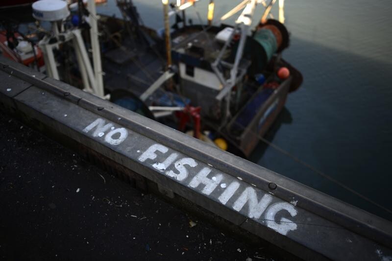 A 'No Fishing' sign is painted onto the quayside in Scarborough