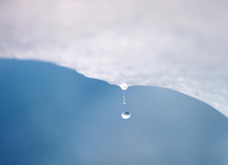 A drop of water falls from a melting piece of ice on Argentina's Perito Moreno glacier near the city of El Calafate, in the Patagonian province of Santa Cruz